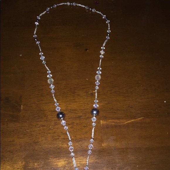 A beaded long necklace with a cross pendant. - Picture 3 of 3